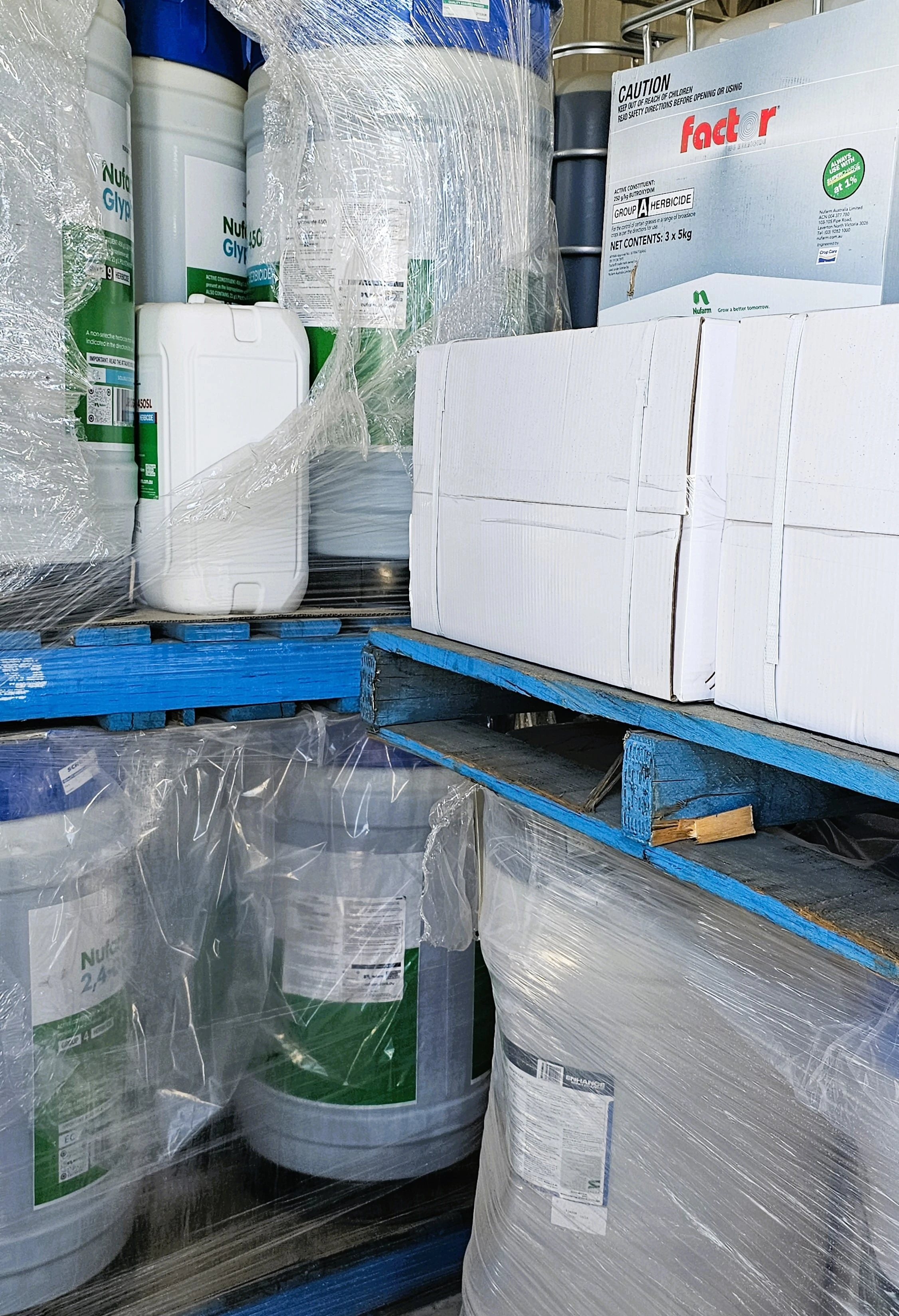 A towering pile of plastic containers alongside various other items stacked together.