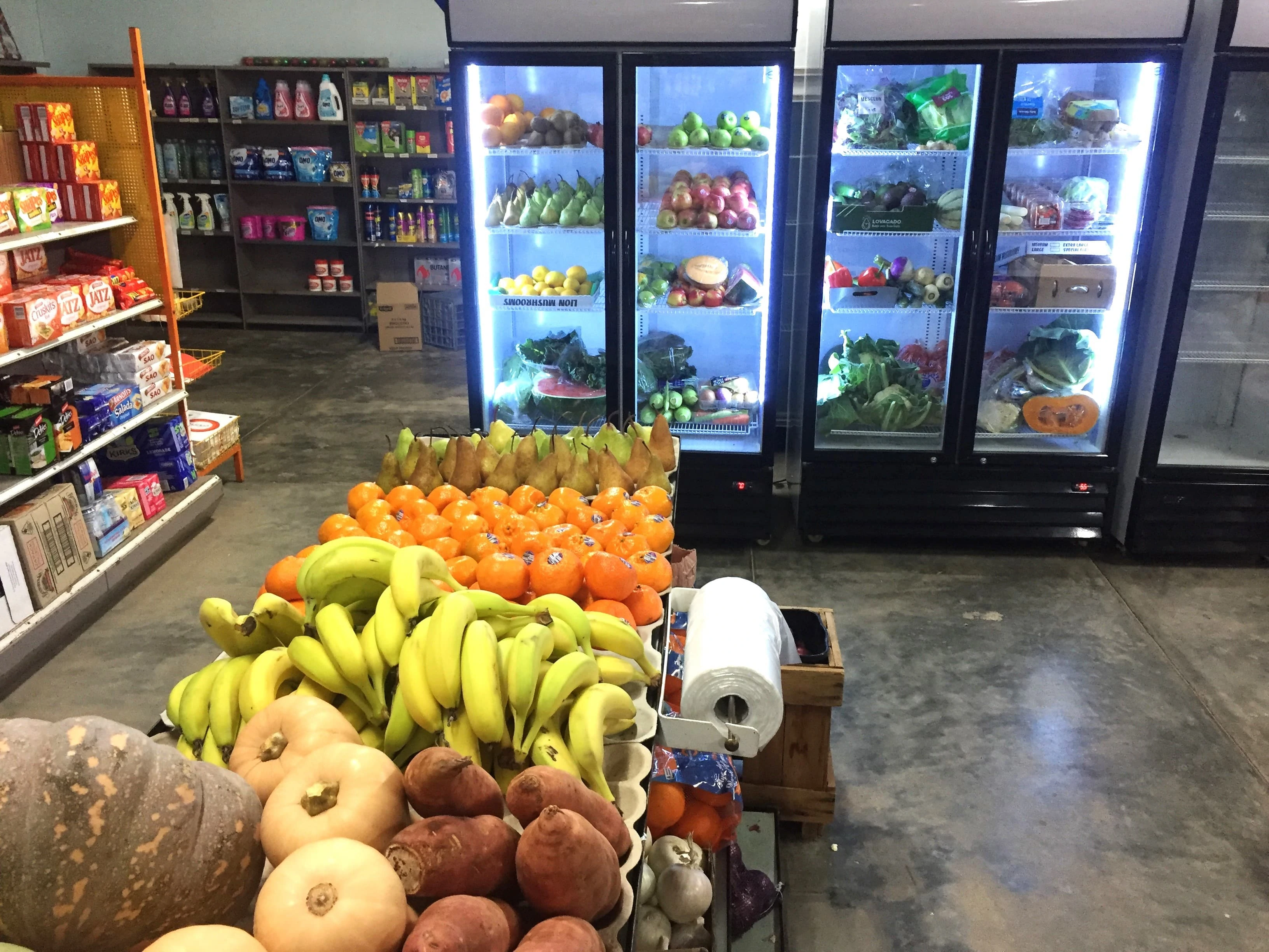 Local harvest grocery store offering fresh green vegetables and fruit shop