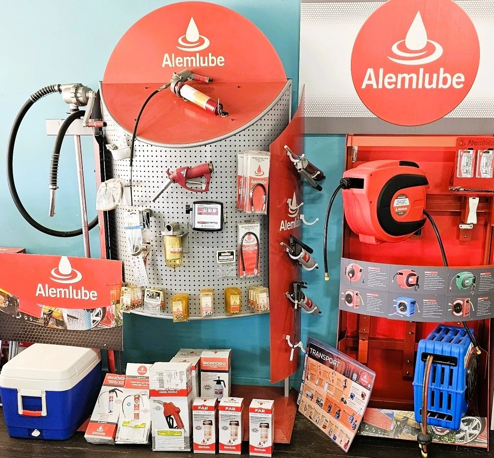 An assortment of items including a pump and a cooler on display.